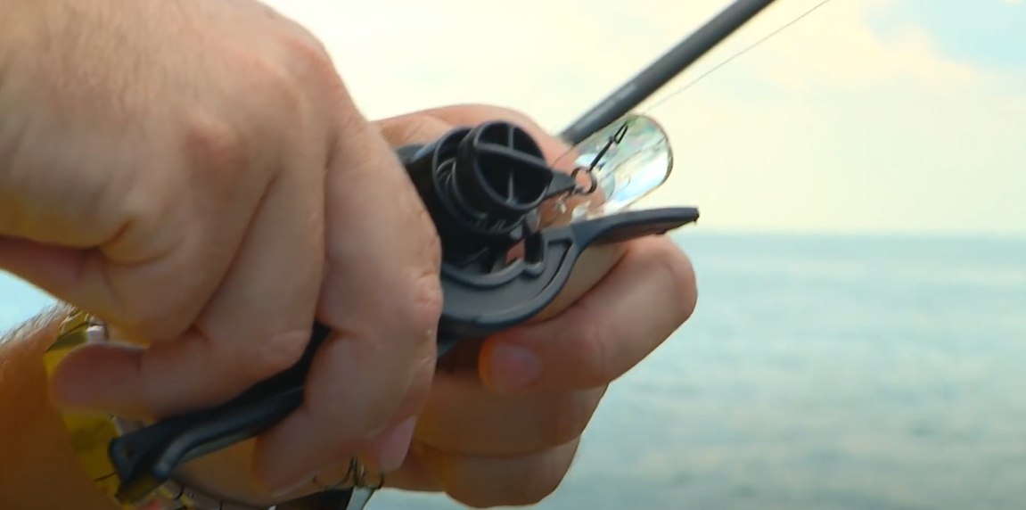 Video: hands using the Off Shore Tackle EZ Crankbait Tuner on a crankbait